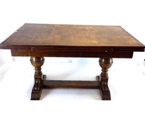 An oak Maple & Co draw leaf dining table, 200cm extended 