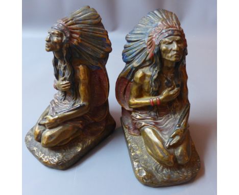 A pair of plaster book ends in the form of native Americans kneeling, signed J.L Lambert, H 22 x W 11 x D 14cm 