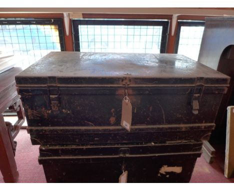An ebonised tin trunk, 33 x 83 x 47cm