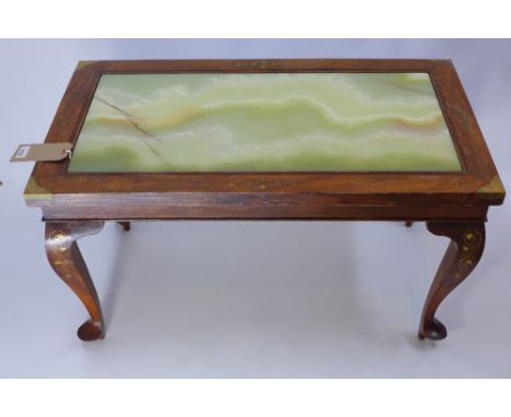 An Indonesian teak and brass bound low table with onyx top, H 50 x W 90 x D 52cm 