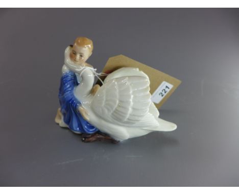 A Copenhagen Bing and Grondahl porcelain model of a girl and a swan, titled 'de vilde svaner' and numbered 547/2500. stamped 