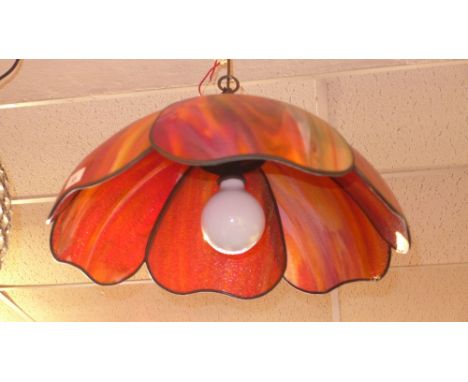 A Tiffany style leaded hanging light, the shade in hues of red and orange 