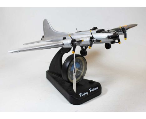 An ASA Flying Fortress quartz alarm clock, in the form of a military aircraft, h.22cmCondition report: Not tested.Very dusty 