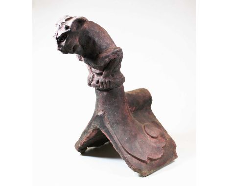 A terracotta ridge tile, probably Victorian, in the form of a demon, h.38cmCondition report: Quite weathered.Various old chip