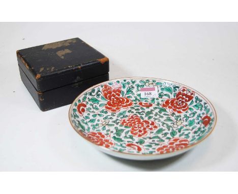 A Chinese porcelain shallow bowl, of circular form, enamel decorated with green leaves, painted with flowers in shades of red