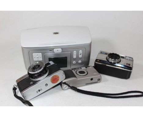 A small collection of cameras and accessories, to include GR1, Kodak photo paper, 177X Instamatic camera etc 