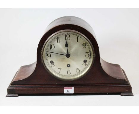 A 1920s mahogany cased mantel clock, having a silvered dial with Arabic numerals and eight day movement striking on a gong, w