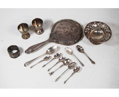 An early 20th century silver pedestal bonbon dish of pierced circular form, together with two silver napkin rings, loose flat