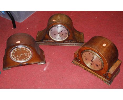 A 1950s oak cased Smith's mantel clock, having eight day movement; together with two other mantel clocks (3)