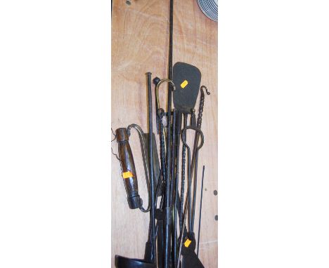 A collection of various 19th century and later tools to include a fire poker and tongs