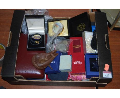 A box of miscellaneous items, to include a boxed Swarovski Little Star ornament, various commemorative crowns, Worcester enam