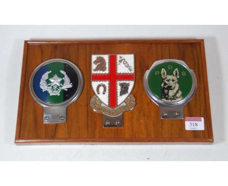 A set of three chrome and enamelled car badges, to include Royal College of Veterinary Surgeons, PDS, and one other military 