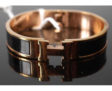 A Hermes of Paris gilt metal and enamel hinged bangle, 62mm; together with a contemporoary Arts &amp; Crafts white metal and 