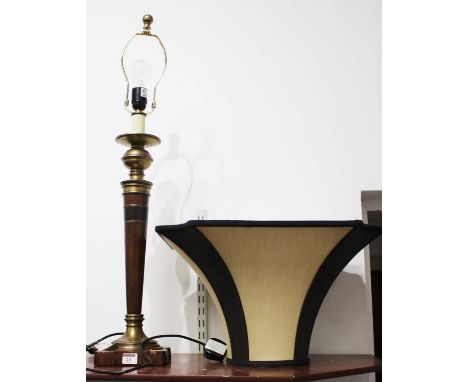 A 20th century turned beech and brass mounted table lamp with shade, h.84cmCondition report: Slight rubbing to the base.Other
