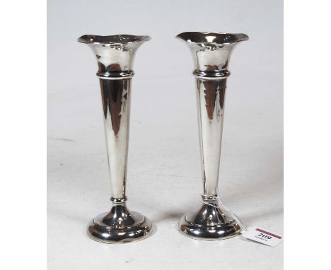 A pair of sterling silver trumpet shaped spill vases, each on loaded base, h.19cm