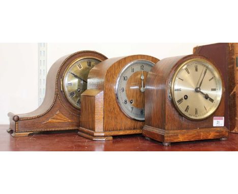 A 1930s oak cased eight day mantel clock, h.20cm; together with another 1930s oak mantel clock by Garrard, and one further ex