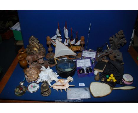 A quantity of miscellanea including wooden candlesticks, Hippo light, magnifier, shells, stress balls, door stop, Stanley Pla