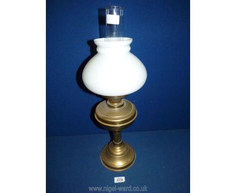 A Brass Oil lamp with chimney and opaque white glass shade