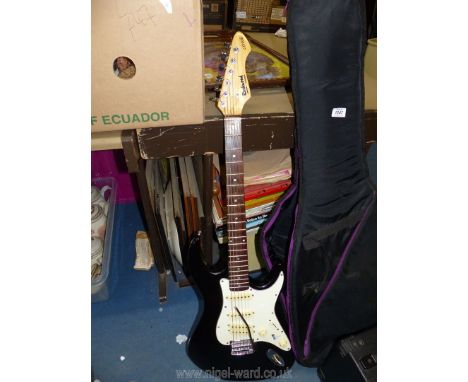 A Hohner Rockwood Electric guitar LX200G (tone knob, no effect) and a Kaces padded carry bag and amplifier BB 10 W blaster.