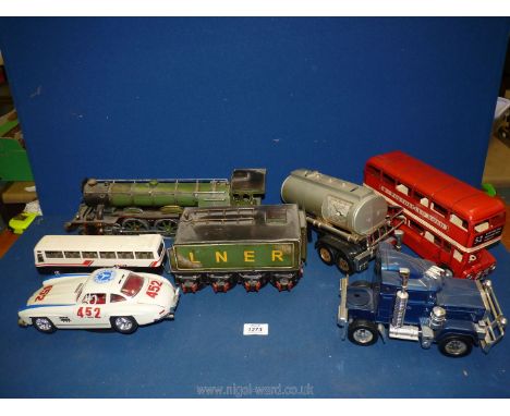 A quantity of large scale model vehicles including 'The Flying Scotsman', Double Decker bus, Burago 'Mercedes 1954' etc.