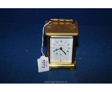 A 19th c. French brass Carriage Clock with white enamel face and bevelled glass, signed Bayard, stamped 9 jewels, Buverdrey a