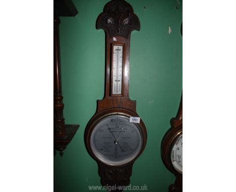 An early 20th c. Art Nouveau carved oak Wall Barometer/thermometer with good white silvered face, 32'' long