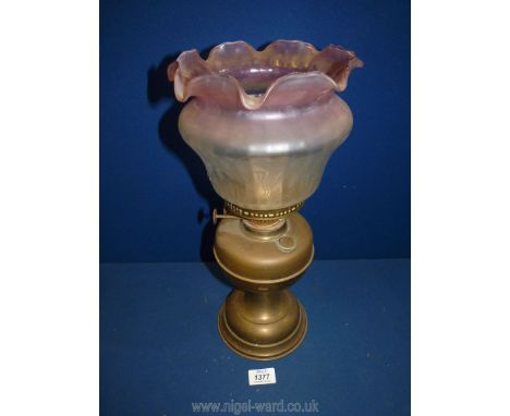An Oil Lamp with etched white and pink shade with fluted rim.