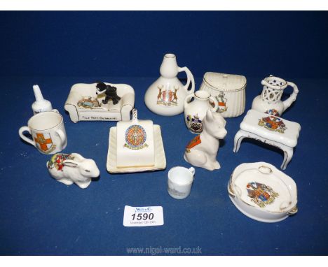 A quantity of Goss and Carlton ware souvenir china including Doncaster dog, March rabbit, posy vase, bell, table etc.