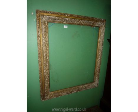 A glazed, carved and formerly gilded picture Frame to suit an art work up to 30 3/4" x 25 3/4", some distress.  A label verso