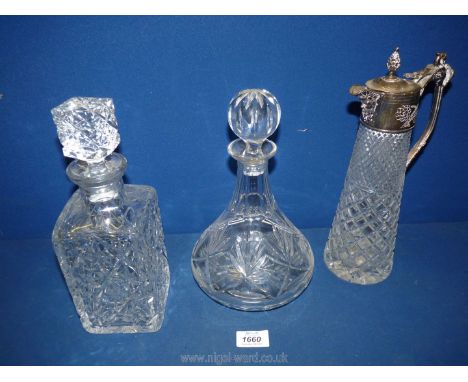A white metal top Claret jug, plus two other decanters (one decanter with repair to rim).