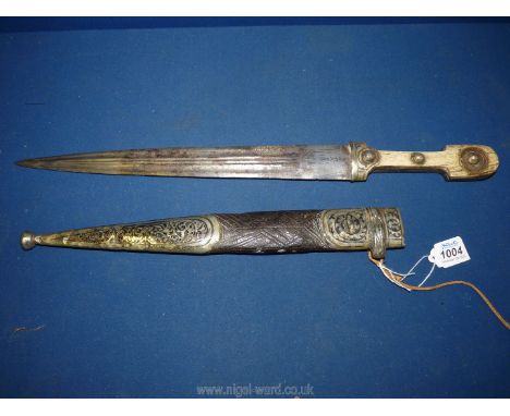 A Caucasian/Eastern Kidjal Dagger and sheath, the dagger having a 12 7/8'' long double fullered blade decorated with a floral