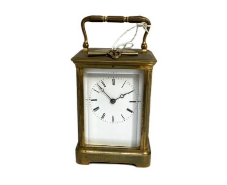 A French brass repeater carriage clock, 20th century,  in a typical four glass and gilt brass corniche case, with enamelled d