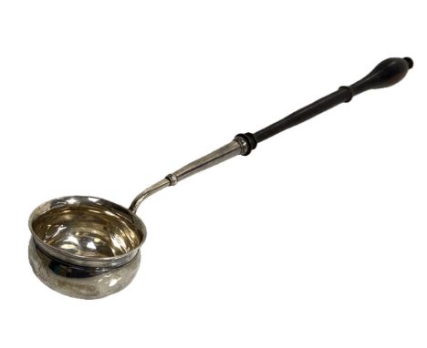A George III silver toddy ladle, circa 1800,  with a deep circular bowl, hallmarks indistinct, London V?, with ebonized handl