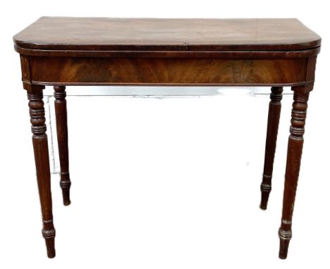 An early Victorian mahogany card table, 19th century,  with rounded foldover top on turned legs, 74cm high, 90cm wide (restor