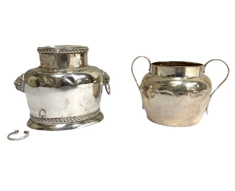 An Edwardian silver tea caddy, Birmingham 1909,  of squat oval form with removable lid, gadrooned borders and twin lion mask 