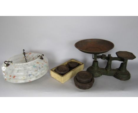 An antique set of cast iron weighing scales with a collection of weights together with further art deco mottled glass ceiling