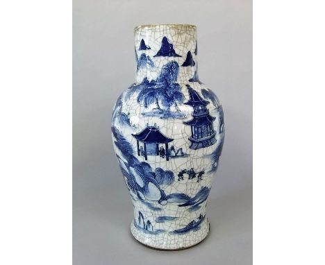 An oriental baluster shaped vase with crackle glaze finish and blue and white painted pagoda and figure decoration (drilled f