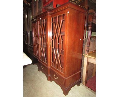 A good quality reproduction Georgian style freestanding dwarf shallow breakfront bookcase enclosed by three quarter length as