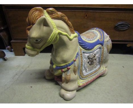 A ceramic garden seat in the form of a horse in ceremonial robes