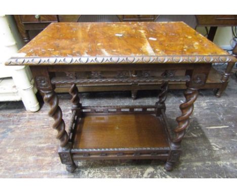 A Victorian oak and figured oak occasional table, the rectangular top raised on four barley twist columns with pierced galler