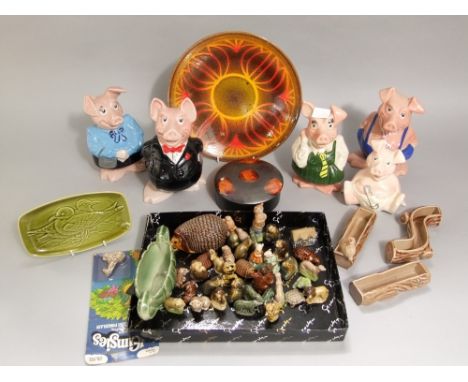 Five Wade Nat West pig money banks, Mother, Father, School Boy, School Girl and Baby, together with a collection of Wade Whim