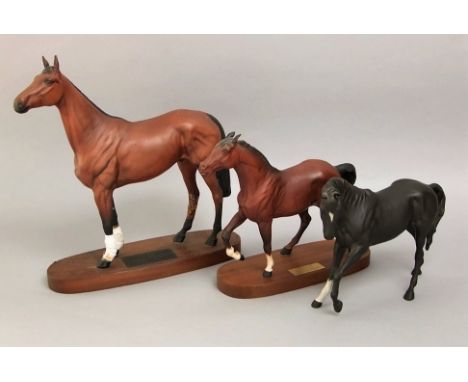 Two Beswick matt glazed figures of race horses - Red Rum (damaged) and Spirit of Fire, both on oval wooden base, together wit