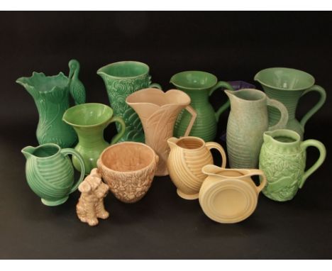 A collection of Art Deco ceramics including a Sylvac buff glazed model of a seated terrier, eleven various Wade, Sylvac and o