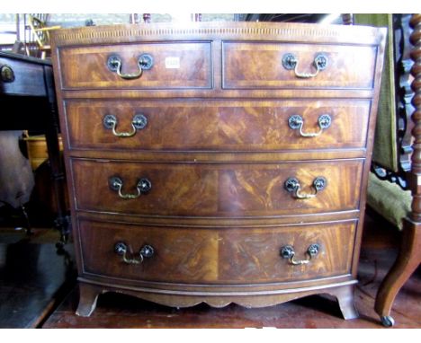 A good quality bow fronted chest of three long and two short drawers with caddy top in the Georgian manner, the drawers cross