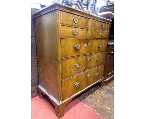 A mid Georgian period countrymade chest in walnut and pine with three long and four short drawers, together with a small cent