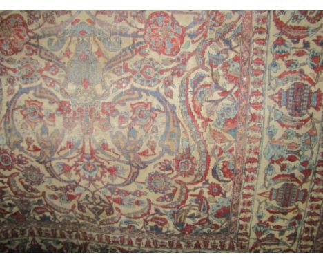 Good quality antique Persian floor rug with scrolled foliage and medallions upon a light ground, 210 x 140 cm