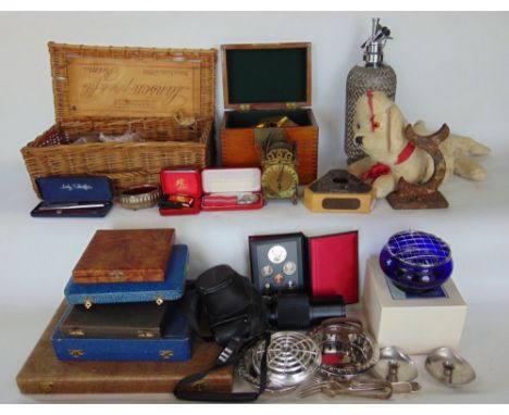 A mixed collection of miscellaneous items to include silver plate, Bristol Blue Glass, a soda siphon, a miniature lantern clo