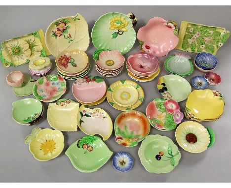 A quantity of Carlton ware and similar dishes for pin's, jam, etc all with relief moulded and painted floral detail or in the