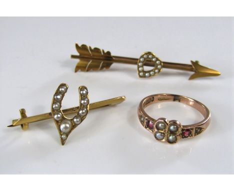 Three seed pearl set items comprising a 15ct Cupid's arrow bar brooch, a wishbone bar brooch in yellow metal and a 9ct ring o