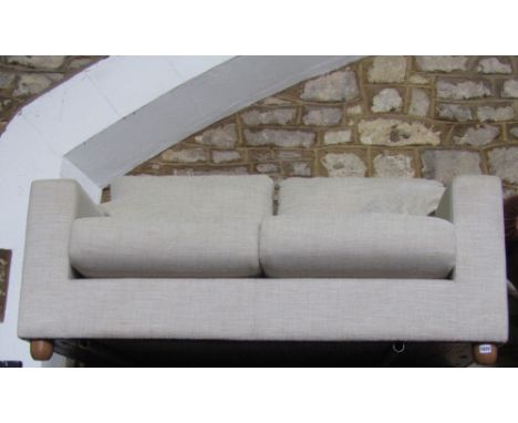 A contemporary two seat sofa, with oatmeal coloured fabric, 150cm wide approx retailed by John Lewis